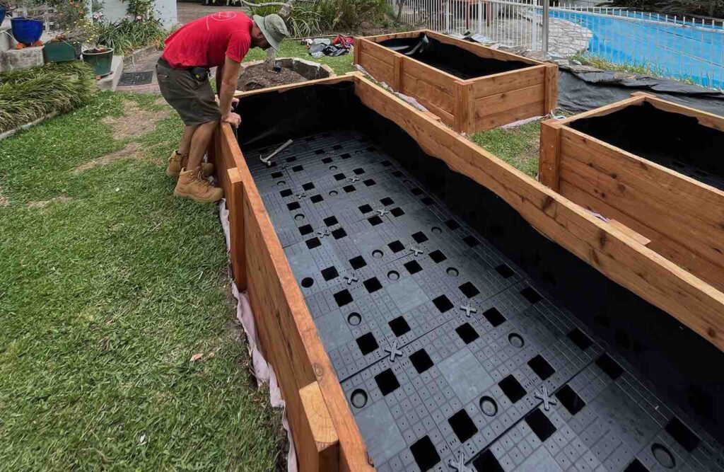 kyle bending over Raised Garden Bed